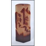 A Chinese tall soapstone wax seal stamp having carved decoration of elder with trees and