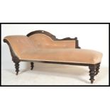 A late 19th century Victorian ebonised mahogany chaise longue - sofa day bed being raised on