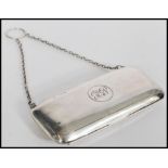 A hallmarked silver early 20th century purse having an engine turned design. Hallmarked for