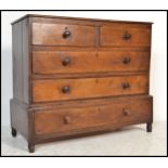 An 18th century country oak chest of drawers on stand. Raised on flared breakfront plinth drawer