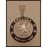 A Chelsea Football Club silver white metal pendant of round form with lion crest to the centre set