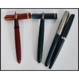 A collection of four vintage 20th Century Parker Fountain / Ink pens to include a Parker Duofold