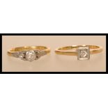 Two 20th century rings to include a stamped 18ct & platinum metal ring with a brilliant cut white