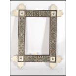 A 19th century Indian Anglo-Colonial vizagapatam picture frame having ivory panel edges with micro-