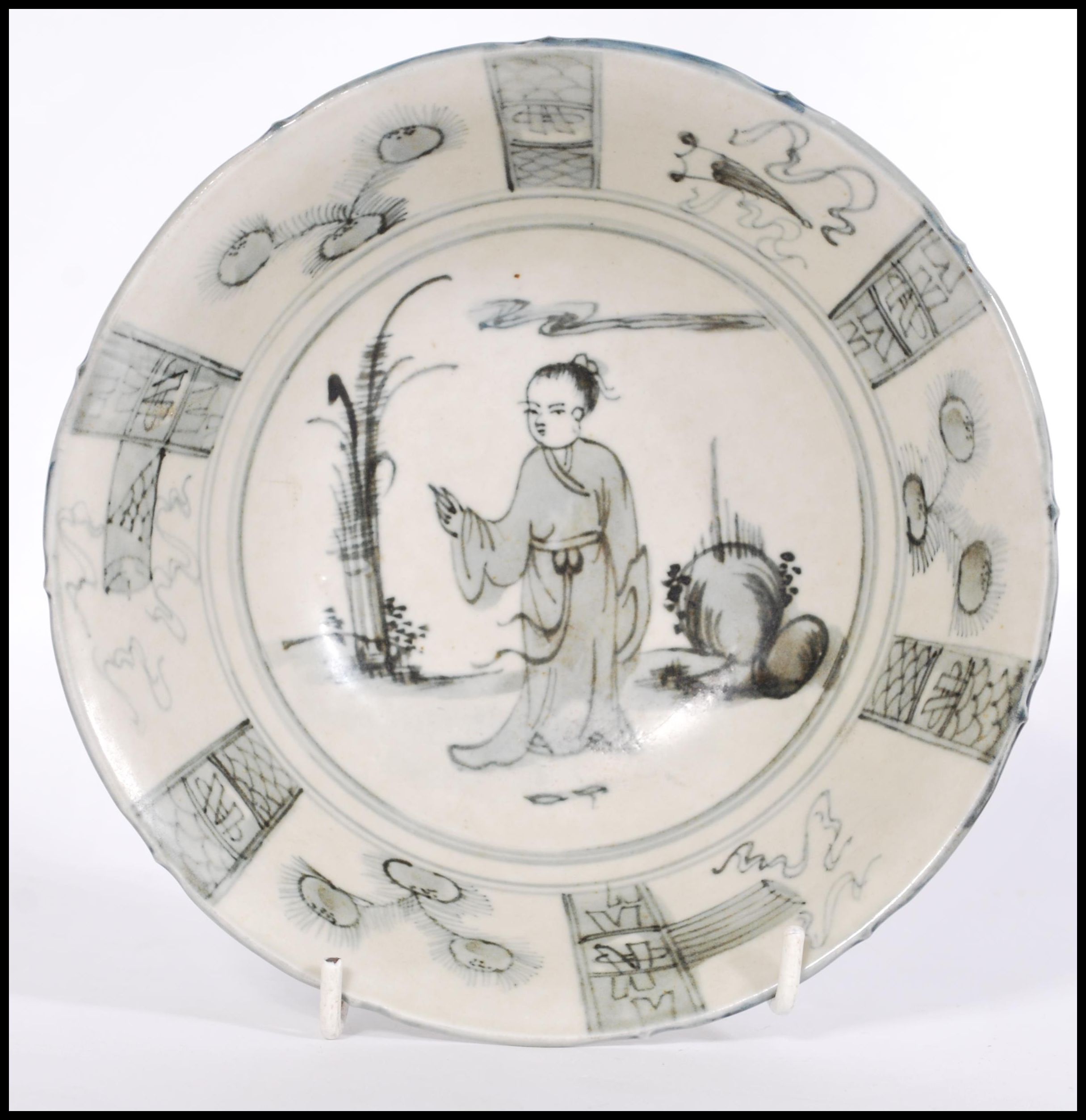 A 19th century Chinese bowl having decoration of maiden with plants and geometric borders. Six