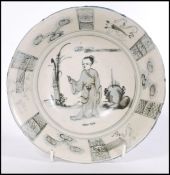 A 19th century Chinese bowl having decoration of maiden with plants and geometric borders. Six