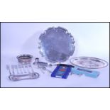 A group of silver plate to include two large salver trays, silver plated and oak wine coaster,