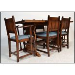 A large Ercol solid oak refectory extending dining table together with a matching set of 6 dining