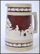 An early 19th Century Copeland rare pattern jasperware hunting jug, having a raised white hunting