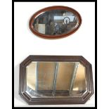 Two vintage early 20th Century wall hanging mirrors, the first or rectangular form having a large