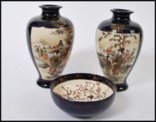 A group of three early 20th century matching Japanese Kutani ware to include a pair of vases with
