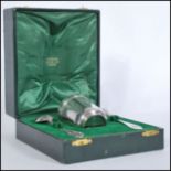 A french silver Christening set consisting of beaker fork and spoon within fitted case. Gilt