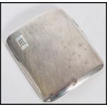 A 1920's silver hallmarked cigarette case with an engine turned exterior. Hallmarked Birmingham