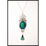 A sterling silver Art Nouveau style pendant necklace in having a blue and green enamelled drop.