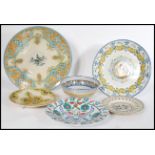 A collection of Faience ware pottery chargers and bowls to include Iznik ware, Italian etc. Measures