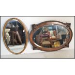 A good 1920's Jacobean revival oak wall mirror with gadrooned borders and embellished details