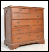 A 17th Century 2 over 4 chest of drawers with frieze panelled sides, having peg joints, swing