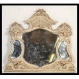 A large 19th Century wall / overmantel mirror with three shaped mirror panels, and a craved wood and