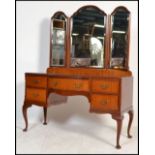A vintage early 20th century 1930's Queen Anne revival mahogany dressing table raised on cabriole