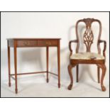 An Edwardian mahogany writing table desk having square tapering legs united by stretchers. Above