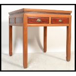 A 20th Century Chinese square lacquered hardwood centre table, the fretted and carved aprons with