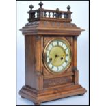 An early 20th Century H A C mahogany bracket clock of architectural form, enamel and gilt face