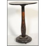 An early Victorian papier mache tilt top table in the manner of Jennens & Bettridge, the circular