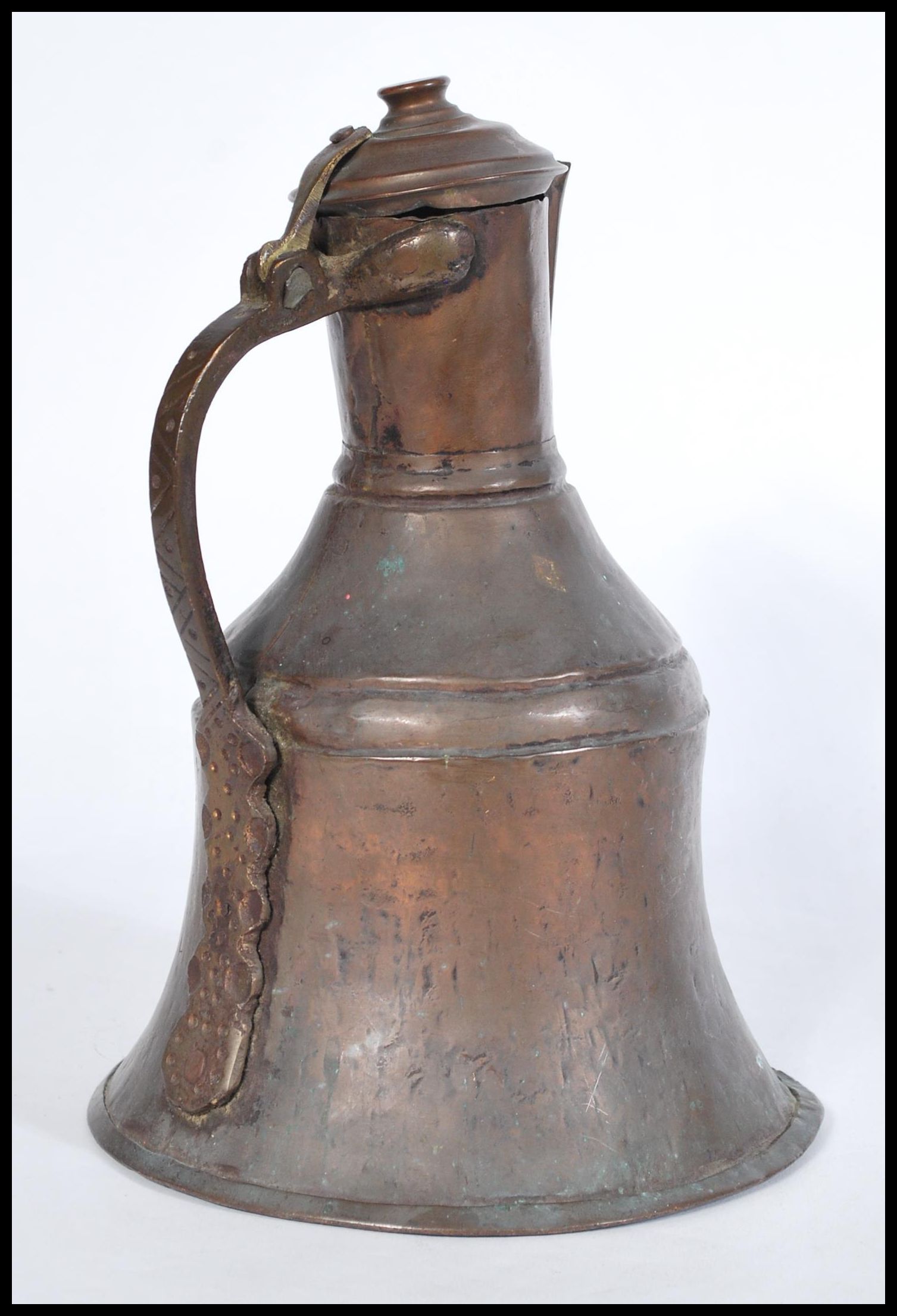 An 19th century middle eastern Persian Islamic brass and copper coffee pot Dallah, probably Turkish. - Image 2 of 4