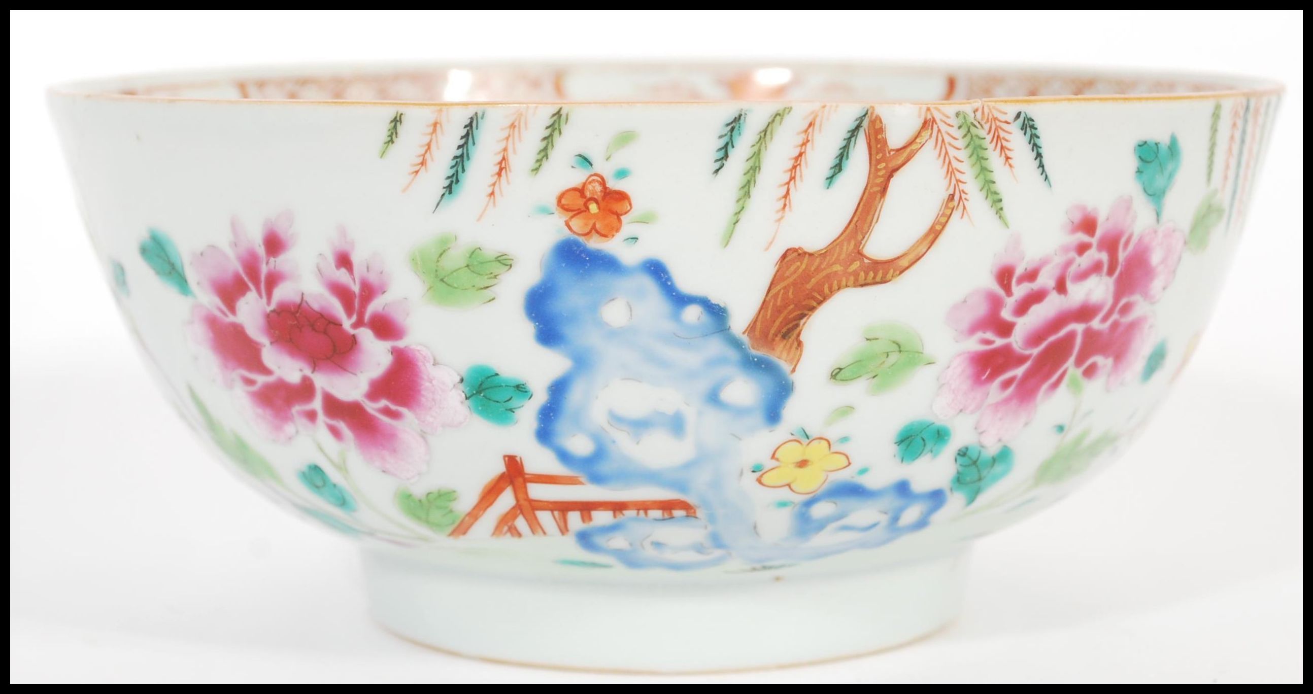 An 18th century small Cantonese Chinese ceramic bowl having hand painted floral spray with trees