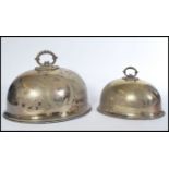 A pair of late 19th Century Victorian silver plated meat covers of domed form having foliate