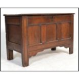 An 18th Century country oak rectangular coffer chest with a plain hinged top and triple moulded