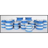 A selection of vintage T G Green & Co Cornishware condiment storage jars in blue and white, labelled