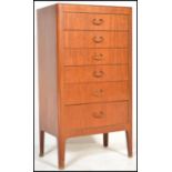 A vintage retro 20th Century teak wood tall upright chest of drawers, six graduating drawers with