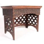 A 20th century Anglo Colonial hardwood campaign folding desk. Raised on a portcullis style panel