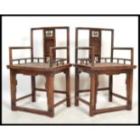 A pair of Chinese walnut Elbow Chairs ( armchairs ) with pierced and carved splats floral