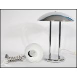 A retro 20th Century chromed mushroom desk lamp, fitted with a mushroom shade raised on a pedestal