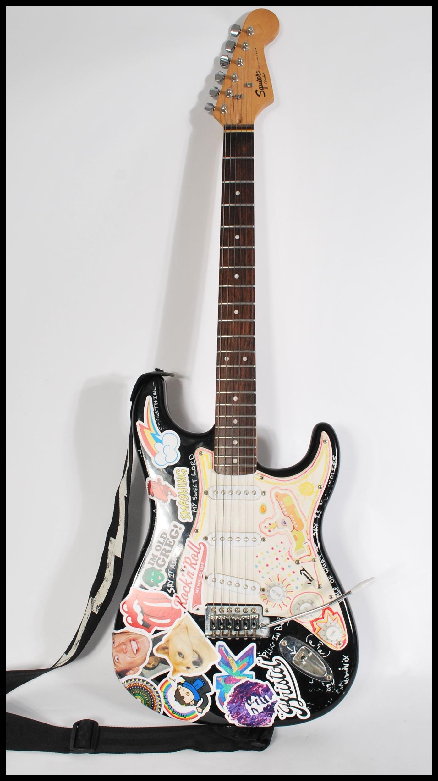 A squire Bullet Strat by Fender Stratocaster six string electric guitar, white body serial number