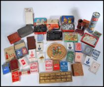 A group of vintage early 20th century gaming playing cards, counters, dice, dice roller etc. along