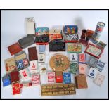 A group of vintage early 20th century gaming playing cards, counters, dice, dice roller etc. along