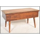 An early 20th century beech wood sewing box stool of rectangular form complete with the contents.