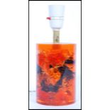 A retro vintage mid century Shatterline amber type resin lamp base in orange. The vase of
