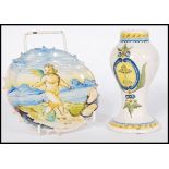 An early 19th century Italian Faience vase having armorial decoration along with a similar plate