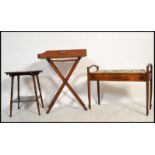 An Edwardian mahogany duet piano stool together with a butlers mahogany folding tray and an