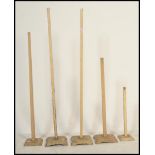 A collection of 6 vintage 20th century wooden shop / haberdashery hat stands. All of varying size
