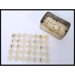 A collection of approx 80 plus early 20th century bovine bone gaming tokens counters of circular