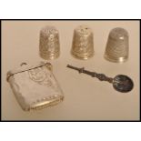 A selection of early 20th century silver items to include a small silver vesta pendant with scrolled