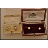 Twos pair of hallmarked 9ct gold collar studs complete in fitted cases one having pearl ends.