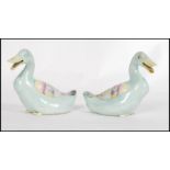 A pair of 19th century Chinese Ming style pottery ducks, each polychrome decorated predominantly