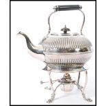 An early 20th Century silver plated spirit kettle on stand, having a turned dark wood handle and