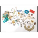 A collection of vintage costume jewellery to include a good selection of brooches to include some